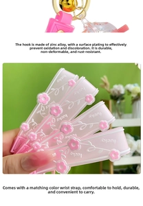Close-up of pink silicone wristlet strap with lucky text and golden floral charm hook