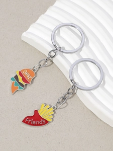 Detail of Best Friends burger and fries enamel keychains with silver chains and rings
