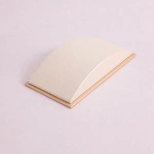 Ergonomic PU leather jewelry display stand with a minimalist beige curved surface