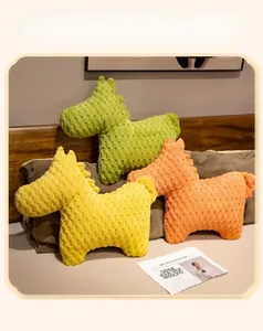 Three colorful horse plush pillows in bean velvet fabric on a bed headboard