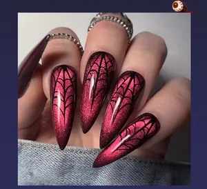Macro detail of long stiletto press-on nails with red cat eye effect and spider web patterns