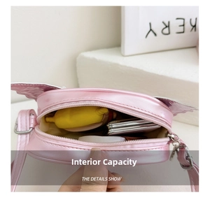 Close-up showing the interior storage capacity of this pink sequin butterfly crossbody bag