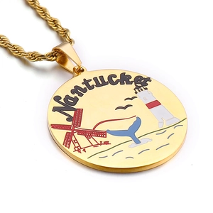 Golden Nantucket souvenir pendant necklace with colorful enamel lighthouse and whale tail