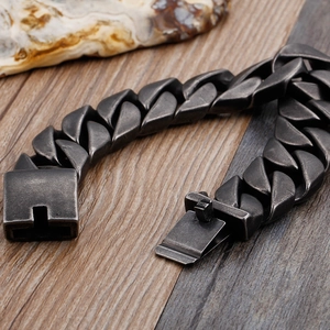 Detailed close-up of 20mm vintage stainless steel Cuban link chain for men with clasp