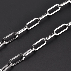 Close-up of polished silver 7mm stainless steel paperclip chain with shiny metallic links
