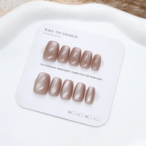 Cat-eye brown press-on nails in short round square shape on display card
