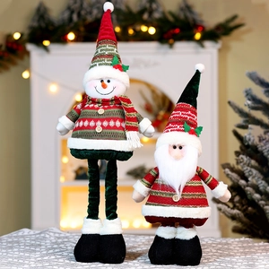 Close-up of Santa and snowman Christmas plush figurines with retractable legs