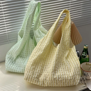 Casual polyester plaid shoulder bag tote, soft fabric, fresh literary style, detail view.
