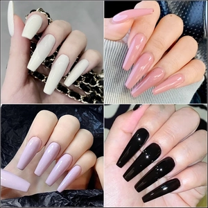 Set of long coffin press-on nails in cream white, lotus pink, lavender, and glossy black