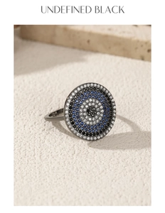 Macro shot of S925 silver ring with black blue micro-pave crystals on stone