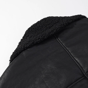 Close-up of black faux leather jacket featuring premium shearling collar and textured finish