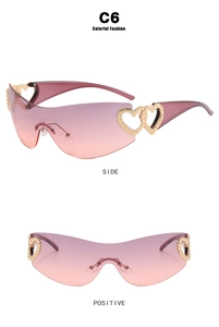 Detail of rimless Y2K sunglasses with heart-shaped hinges and gradient pink-purple lenses