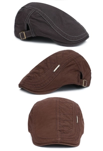 Detail of vintage cotton flat cap featuring double stitching and metal adjustment buckle