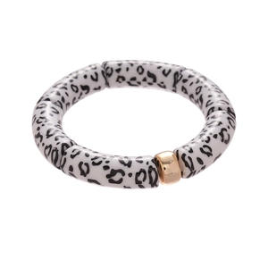 Minimalist geometric acrylic leopard print bracelet with polished gold metal bead accent