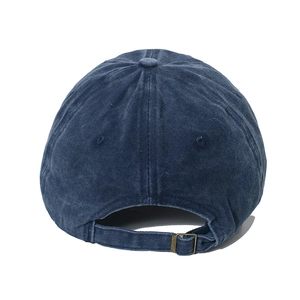 Detail of navy blue washed cotton baseball cap with adjustable vintage metal buckle closure