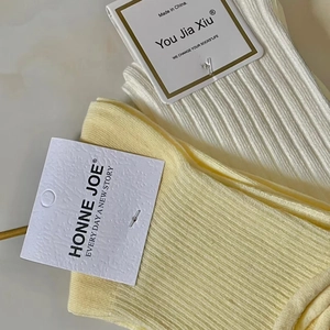 Classic ribbed cotton mid-calf socks in white and pale yellow with floral embroidery