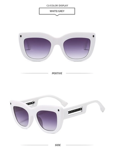 Detailed side view of white cat-eye sunglasses with purple gradient lens and chain temple