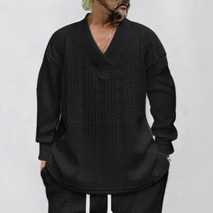 Detail of classic cable-knit texture on a black V-neck long sleeve sweater for men