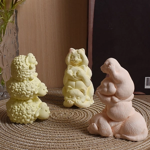 Cute cartoon sheep cat and puppy stacked scented candles on a rustic woven mat