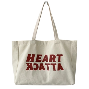 Minimalist cream canvas tote bag with red Heart Attack print and large interior capacity
