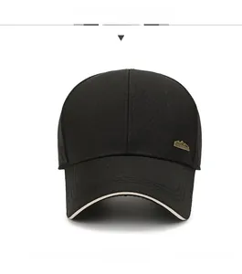 Front view of black baseball cap with golden mountain badge and layered sandwich brim detail
