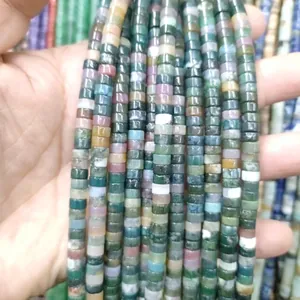 Macro shot of assorted cylindrical natural stone beads in mixed colors for jewelry making