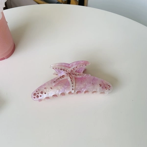 Pink starfish acetate hair claw clip with rhinestones and marble texture for women