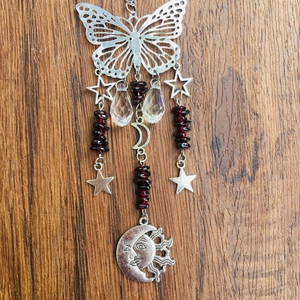Detailed silver butterfly suncatcher with crystal drops and celestial star moon charms