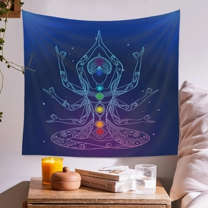 Detail of yoga meditation tapestry with seven chakra symbols on a gradient blue background