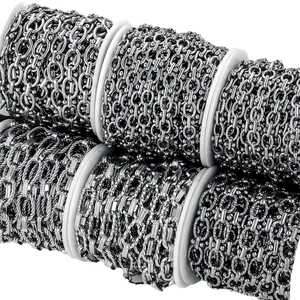 Multiple styles of DIY stainless steel jewelry chains in silver rolls on white backdrop