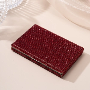 Macro shot of red rhinestone business card holder with luxury crystal texture and metal latch