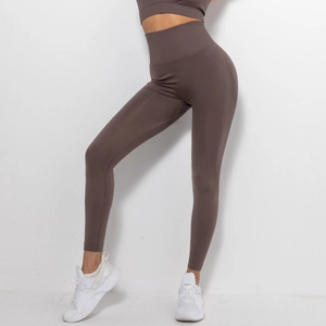 Detailed view of coffee brown seamless knitted yoga pants with a high compression waistband