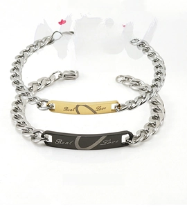 Detailed view of Real Love stainless steel couple bracelets with split heart design
