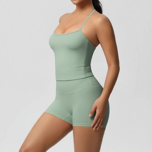 Side view of sage green yoga set showing seamless high waist shorts and thin strap vest