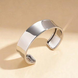Polished silver wide open cuff bracelet with geometric minimalist metal mirror finish