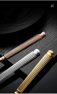 Close-up of Roman column textured stainless steel cutlery handles in gold and silver