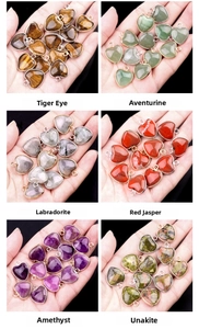 Detail showing natural amethyst and agate heart pendants with metal edges in various colors