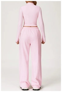 Rear view of pink long sleeve slim top and high waist wide leg sports trousers set
