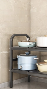 Detail of thickened carbon steel under-sink rack with heat-resistant black finish
