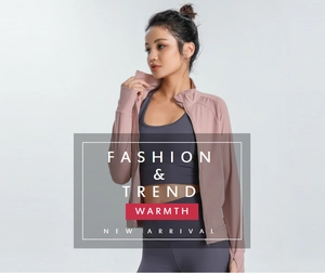 Detail of pink slim-fit sports jacket with thumb holes and charcoal grey yoga leggings