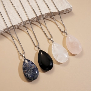 Long necklace with teardrop natural stone pendants in blue black white and pink