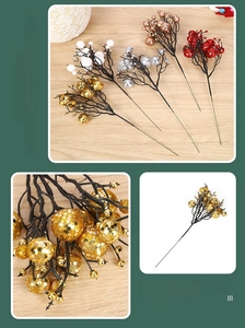Close-up of glittery Christmas berry stems in gold, silver, red, and white for tree decoration