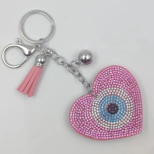 Pink heart rhinestone keychain with evil eye pattern, pink tassel and metal ring