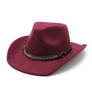 Detail of burgundy cowboy felt hat showing ethnic woven band and metal buckle accents