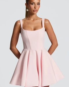 Close-up of pink puff mini dress featuring a square neckline and structured corset-style bodice