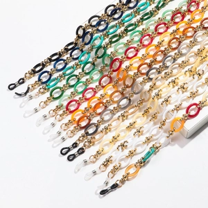 Detail of colorful acrylic eyeglass chains with gold metal links and silicone loops