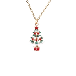 Christmas tree necklace pendant with green enamel and gold chain on white background