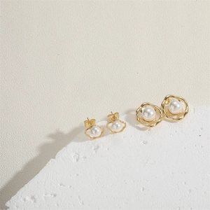Elegant gold alloy stud earrings with pearls and irregular ring design for women