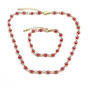 Parure de bijoux dorés avec collier et bracelet à l'œil maléfique en émail rouge