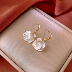 Elegant gold flower zircon geometric hook earrings displayed on a luxurious silk background